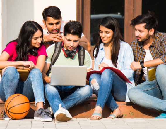 A group of students discussing each other.